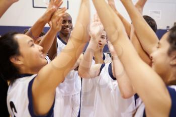 High School Sports Team Celebrating In Gym