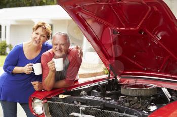 Senior Couple With Restored Classic Car