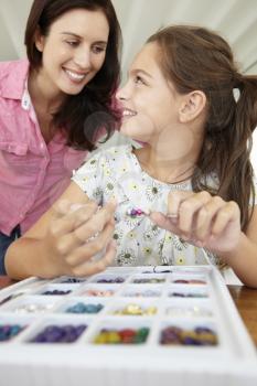 Mother and daughter making jewellery