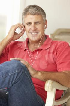 Mid age man wearing earphones
