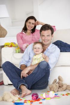 Parents at home with baby girl