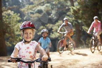 Young family on country bike ride