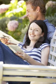 Couple reading in garden