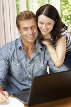 Couple Working In Home Office