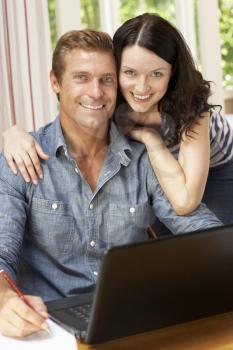 Couple Working In Home Office