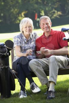 Senior couple on golf course