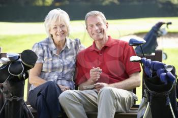 Senior couple on golf course