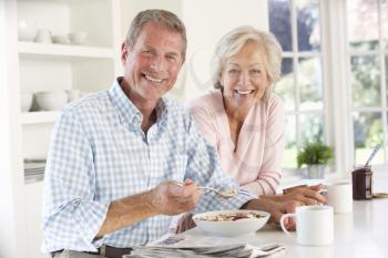 Retired couple eating breakfast