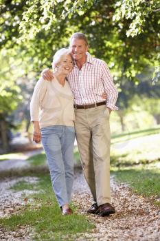 Senior couple walking in park