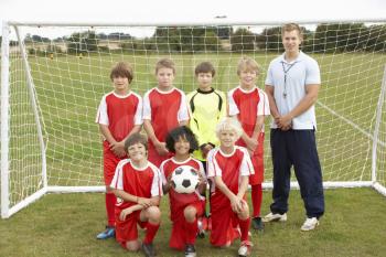 Junior football team and coach portrait