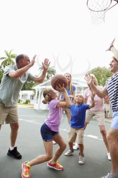 Multi Generation Family Playing Basketball Together