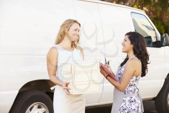 Two Women Running Catering Business With Van