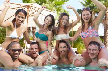 Portrait Of Friends Having Party In Swimming Pool