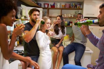 Group Of Friends Enjoying Drinks Party At Home