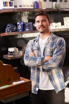 Portrait Of Male Barber Standing By Cash Register