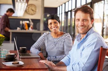 Man and woman meeting over coffee in a restaurant