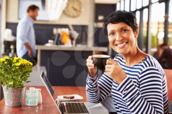 Woman drinking coffee, portrait