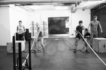 Black And White Shot Of People In Gym Circuit Training