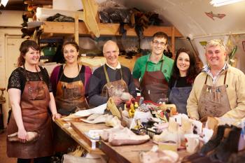Shoemakers, group portrait in their workshop