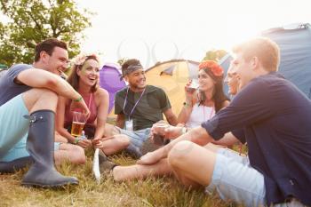 Friends having fun on the campsite at a music festival