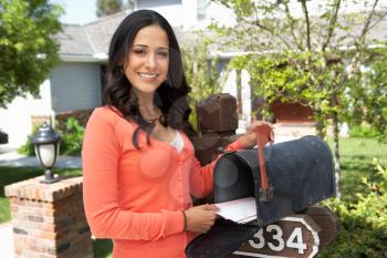 Hispanic Woman Checking Mailbox