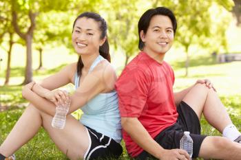 Asian couple resting after exercise