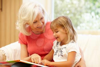 Grandmother and granddaughter reading