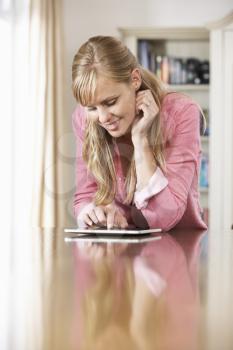 Woman Using Digital Tablet At Home