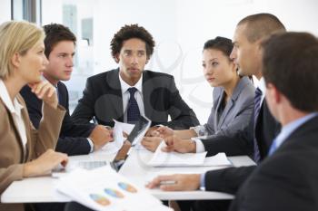 Group Of Business People Having Meeting In Office