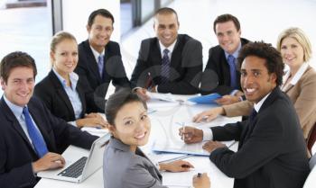 Portrait Of Business People Having Meeting In Office