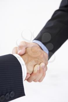Close Up Of Two Businessmen Shaking Hands