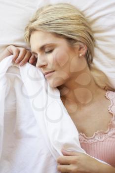 Woman Sleeping In Bed