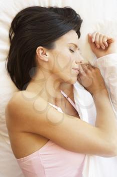 Woman Sleeping In Bed