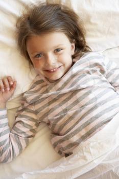 Young Girl Relaxing In Bed
