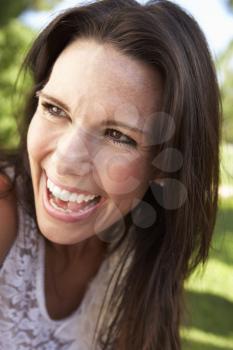 Head And Shoulders Portrait Of Smiling Woman
