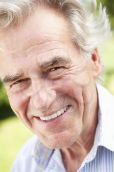 Head And Shoulders Portrait Of Smiling Senior Man