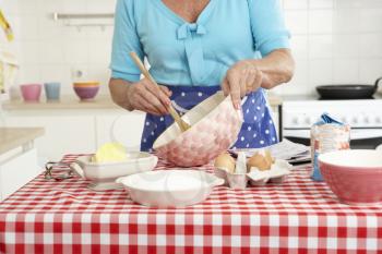 Senior Woman Baking In Kitchen