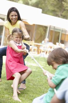 Mother And Children Playing Tug Of War