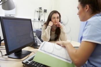 Nurse Discussing Test Results With Patient