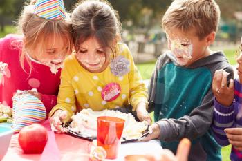 Group Of Children Having Outdoor Birthday Party