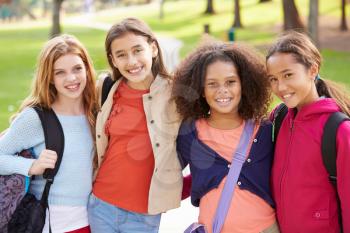 Group Of Young Girls Hanging Out In Park Together