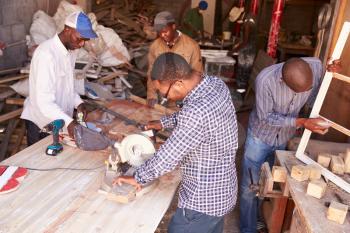 Group of men at work in a carpentry workshop, South Africa