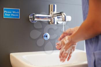 Close Up Of Medical Staff Washing Hands