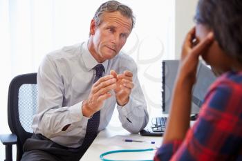 Doctor Treating Female Patient Suffering With Depression