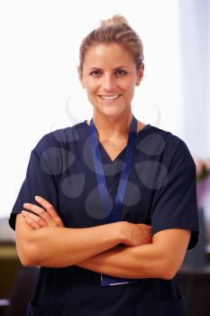 Portrait Of Nurse In Hospital Wearing Scrubs