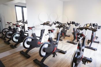 Row Of Spinning Bikes In Gym