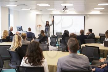 Businesswoman Making Presentation At Conference