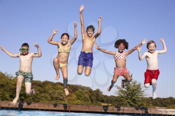 Group Of Children Jumping Into Outdoor Swimming Pool