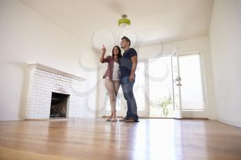 Excited Couple Explore New Home On Moving Day