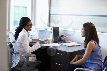 Doctor Wearing White Coat Meeting With Female Patient